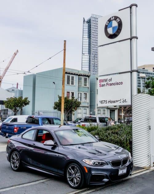 BMW of San Francisco dealership exterior with BMW vehicle in foreground